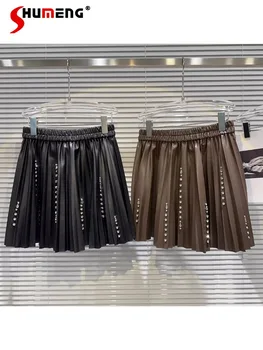נשים קפלים החצאית 2023 סתיו חורף חדשה כבד תעשיית היהלומים חרוזים בחורה שווה עור PU חצאית אופנה קוריאנית בגדים